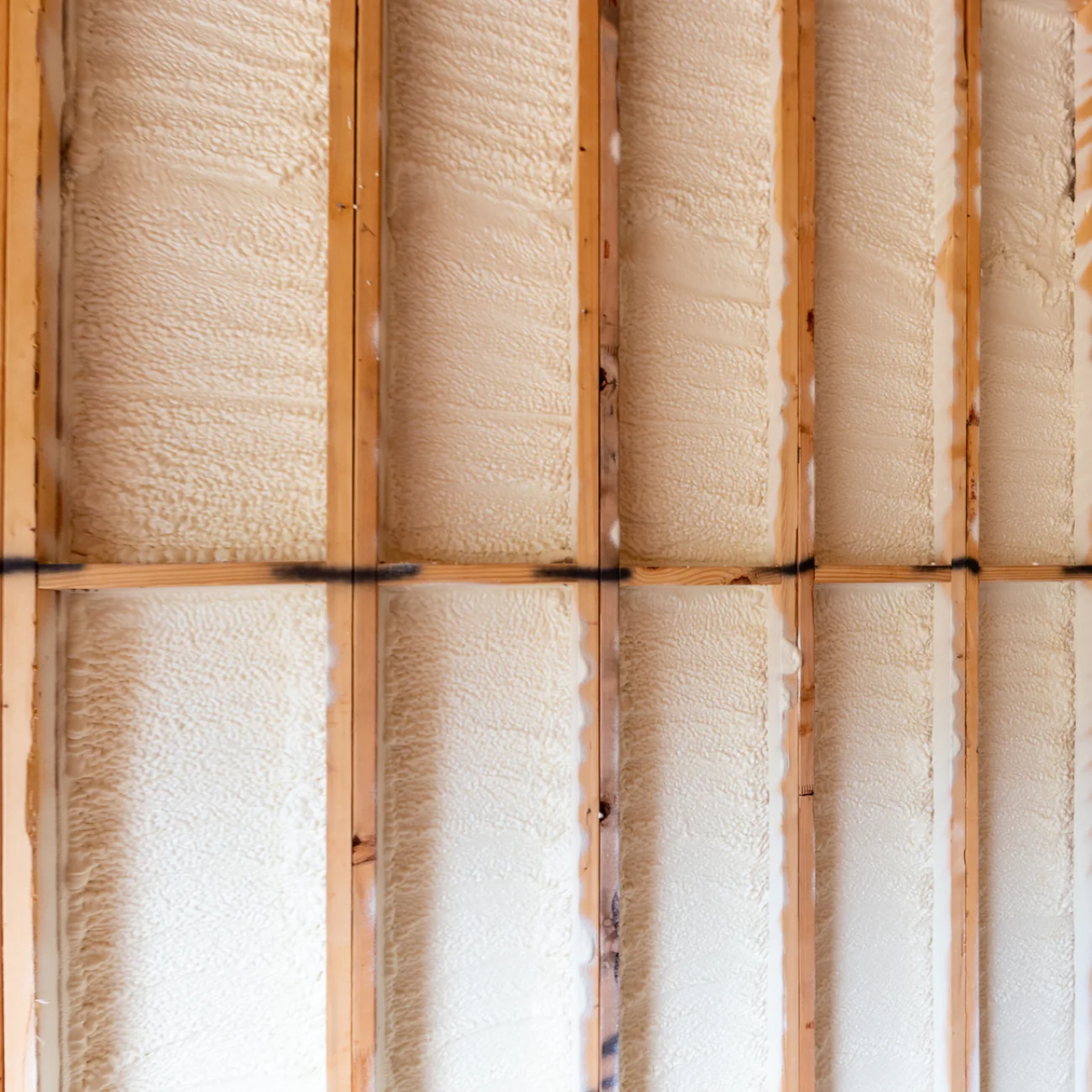 What are the structural benefits of closed-cell spray foam?